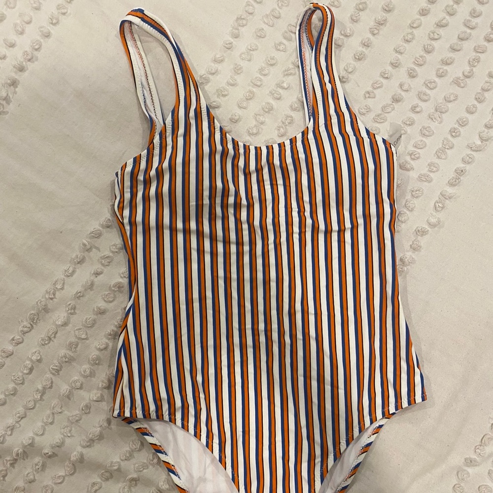 Orange, blue and white striped one piece suit